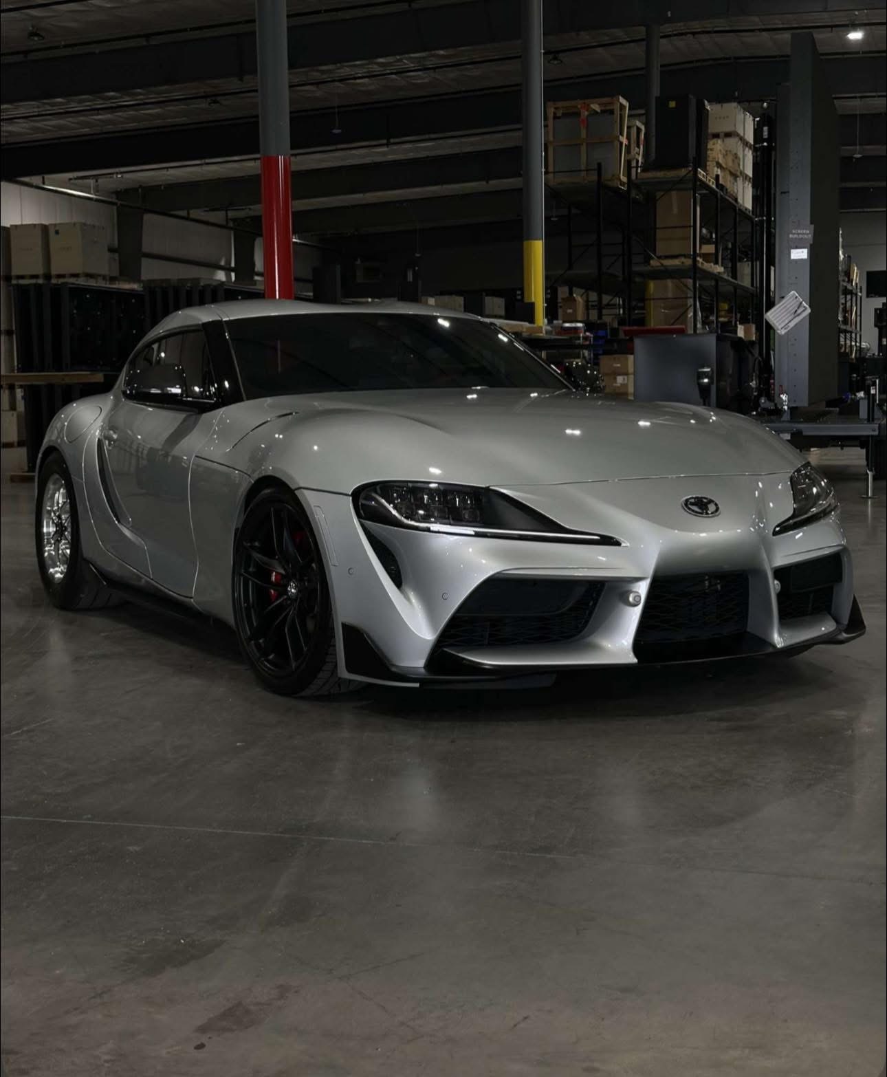 Pristine silver Toyota Supra showcasing premium auto detailing results